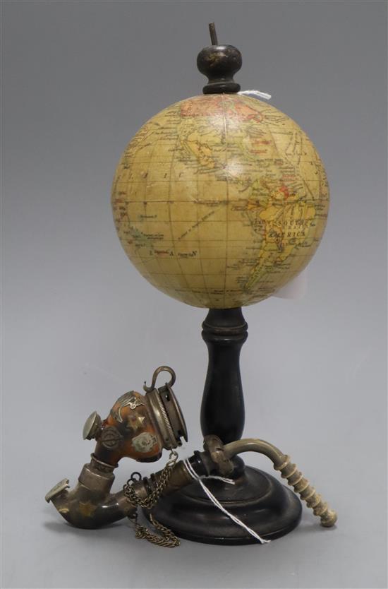 A small table globe on ebonised stand and a pipe globe height 23cm